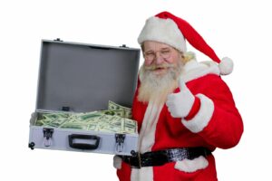Św. Mikołaj z walizką pełną pieniędzy